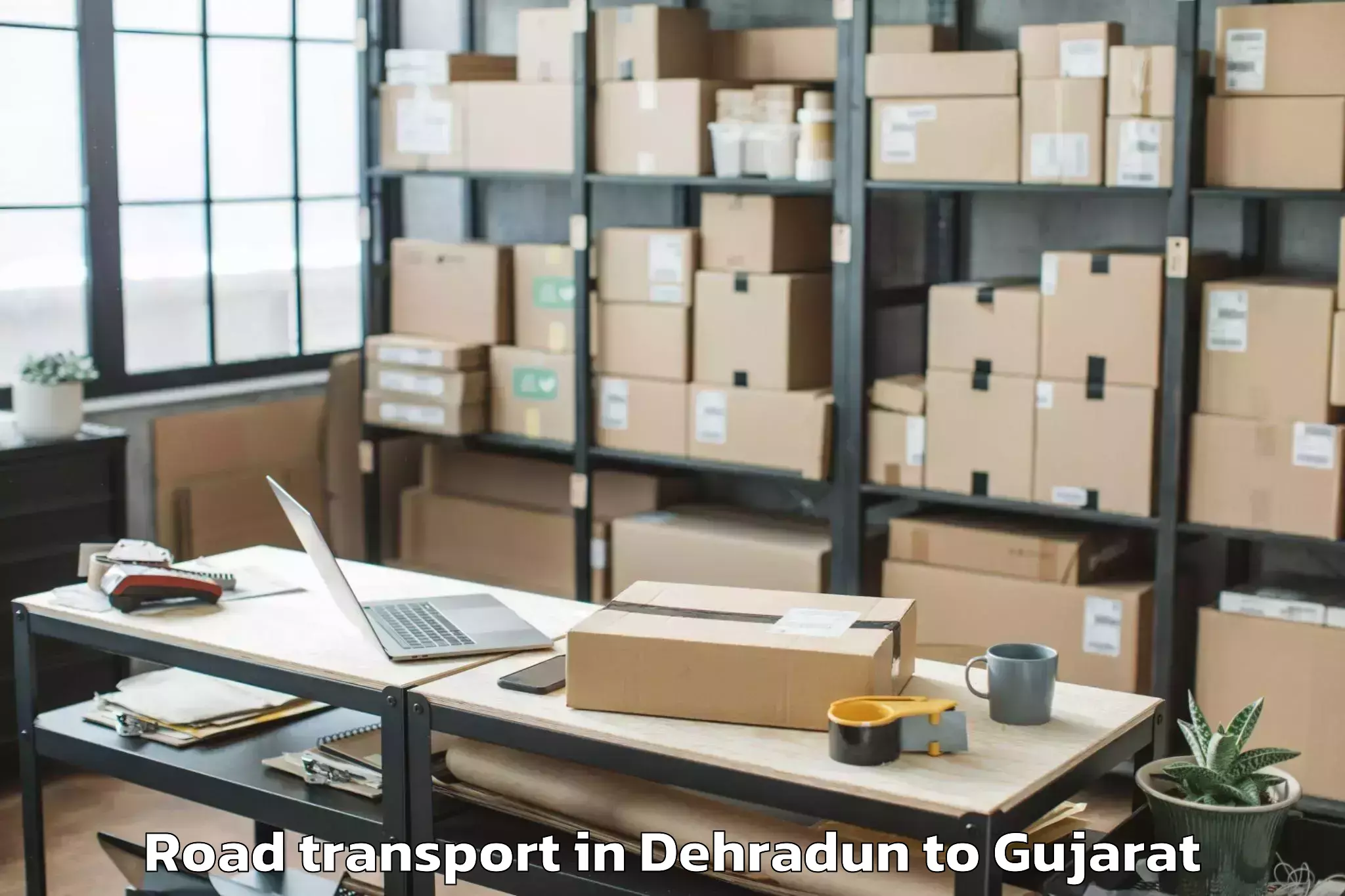 Book Dehradun to Kadod Road Transport